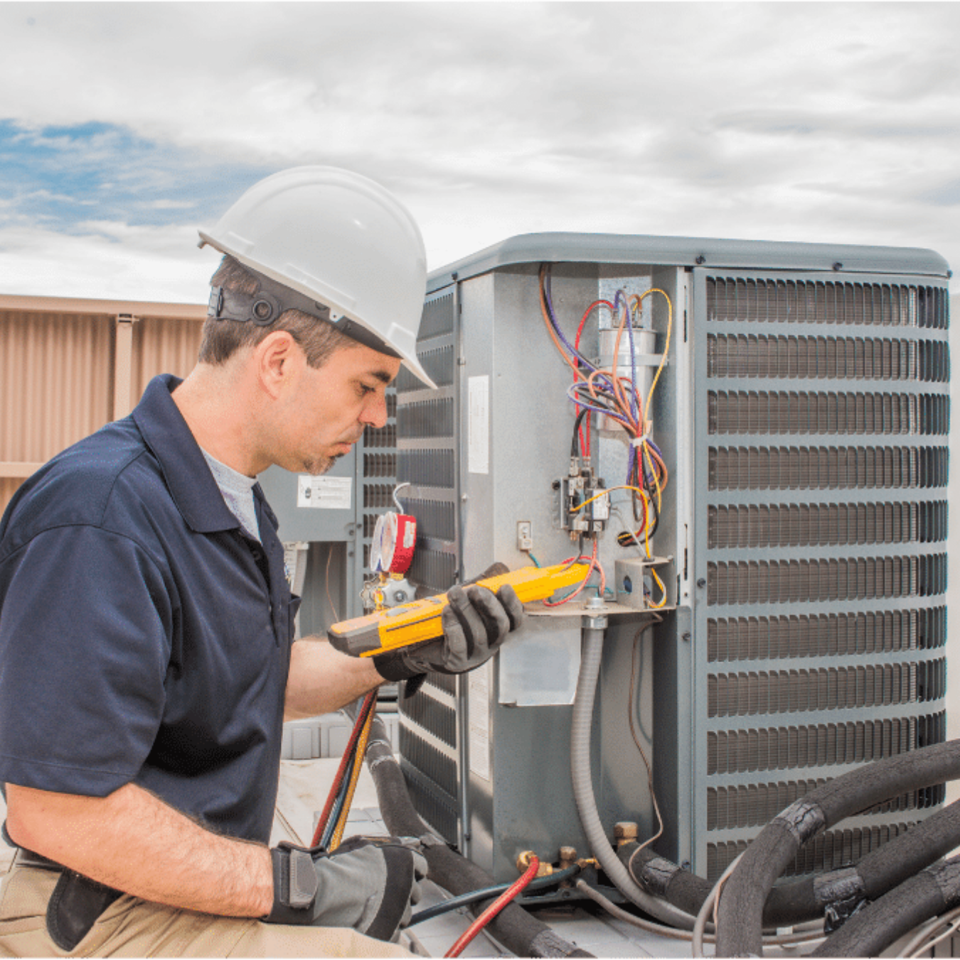 Windsor AC Repair HVAC technician servicing a system